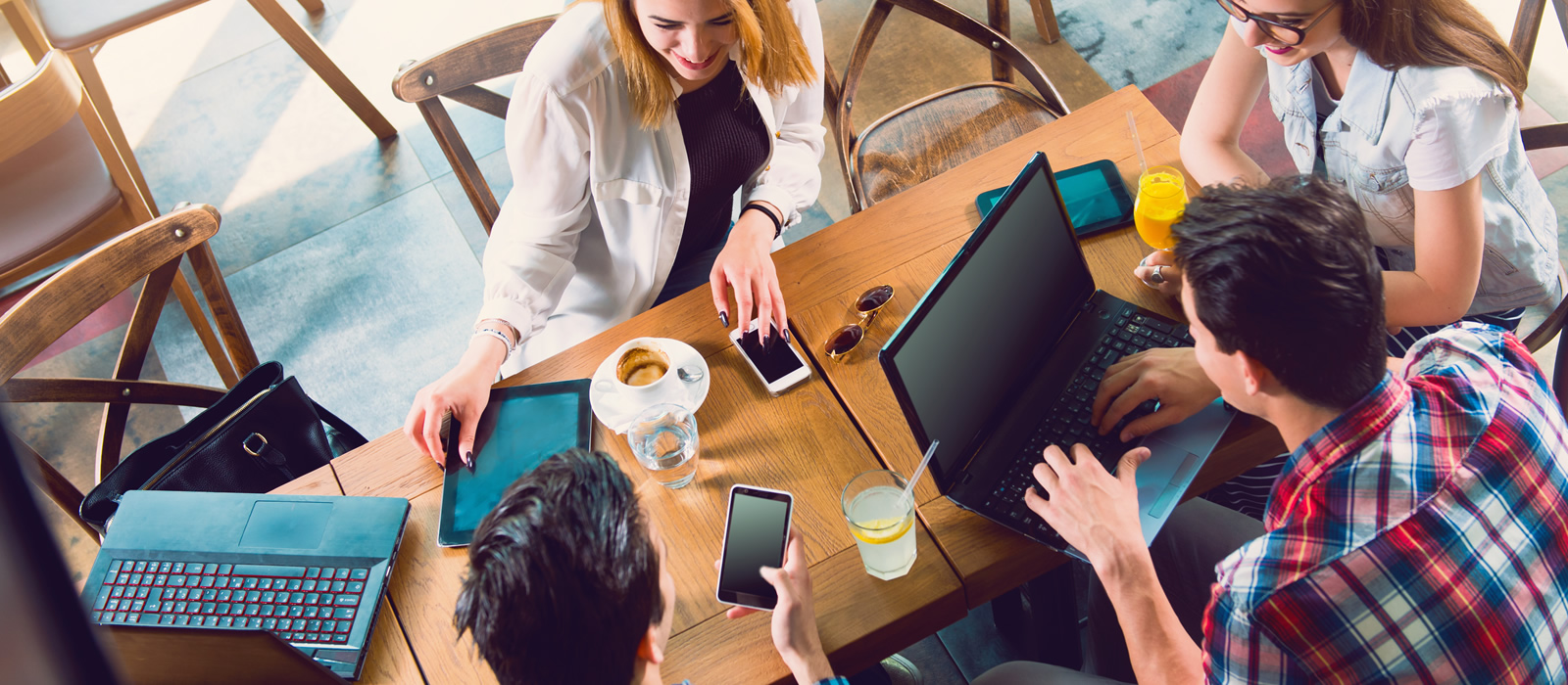 People collaboratively working at a table.