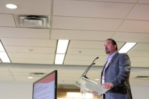 Chief Benedict Abram speaking into a microphone