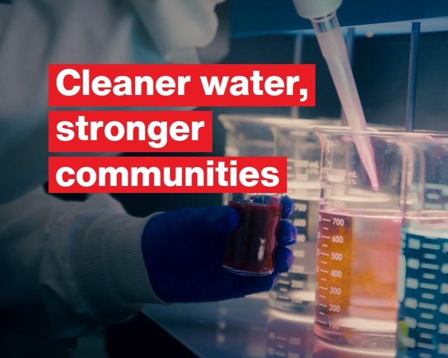 Image with beakers with liquid in them states: Cleaner water, stronger communities