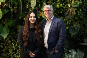 James Milner and Rez Gardi posing in front of a living green wall.