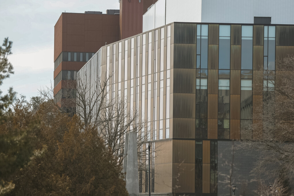 External shot of a building with gold siding.