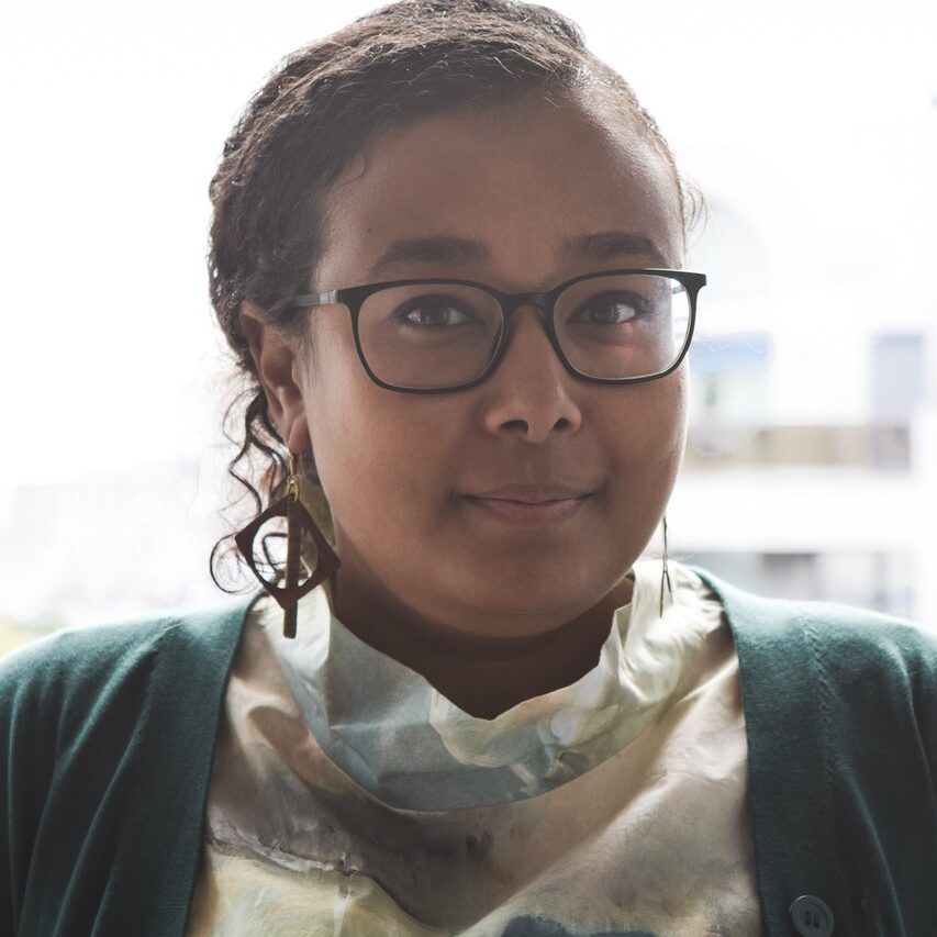 Headshot of Menna Agha.