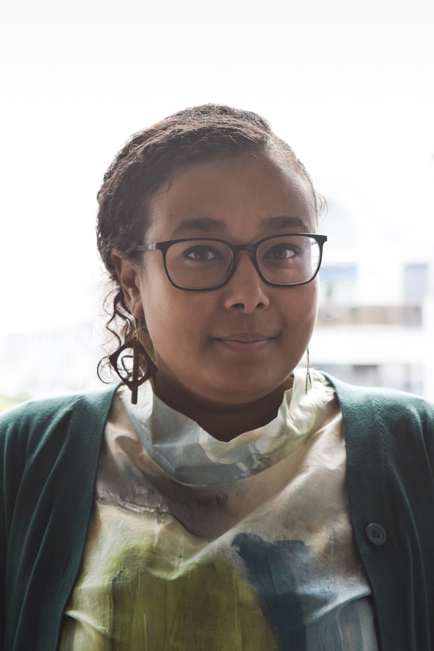 Headshot of Menna Agha.