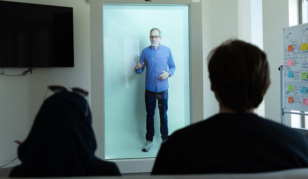 Anderson uses the low-latency ARHT HoloPresence unit to beam himself into a different room