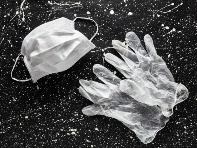 face mask and gloves on floor